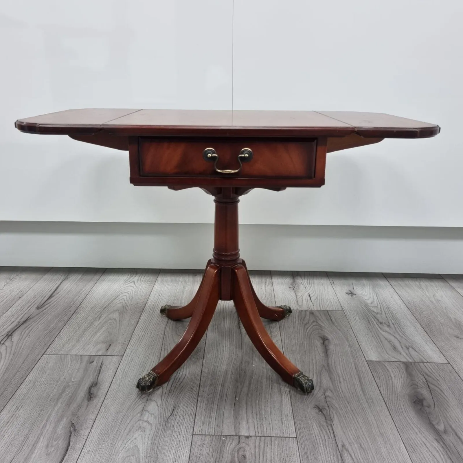 photo furniture Pair Of Antique Flamed Hardwood Extending Side Tables With Lion Paw Castors And Double Sided Drawers