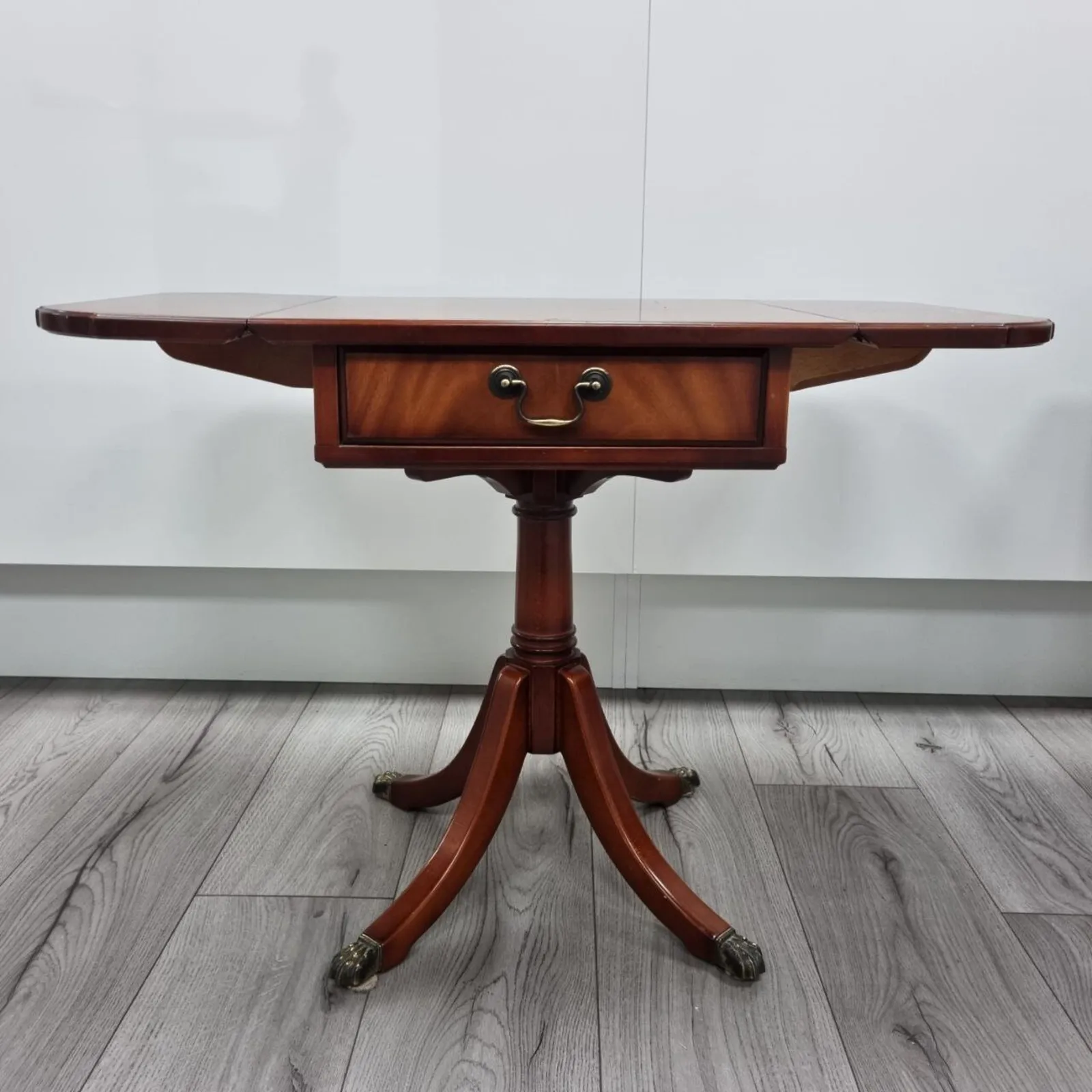 photo vintage Pair Of Antique Flamed Hardwood Extending Side Tables With Lion Paw Castors And Double Sided Drawers