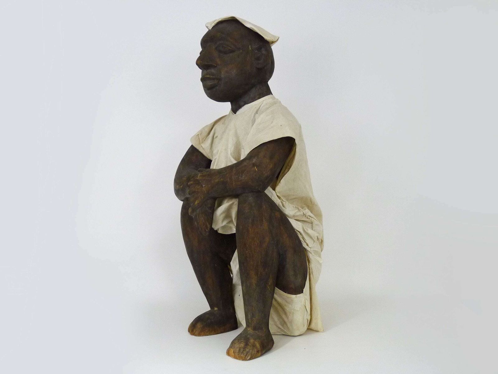Very Large African Dogon Statue From Mali, Seated Dressed Man. First Half Of The 20th Century photo for sale
