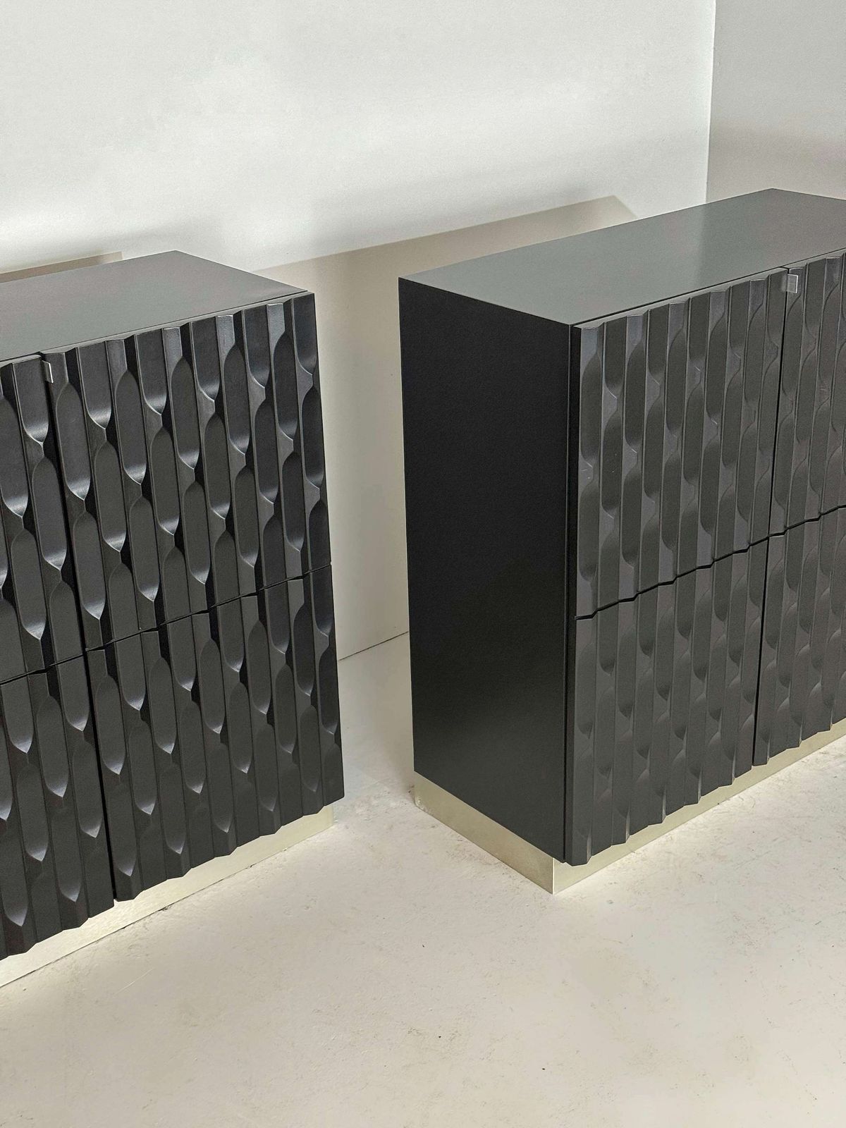 photo furniture Pair Of Black Brutalist Cabinets With Graphic Door Panels, 1970s