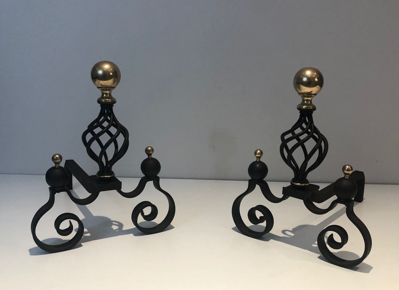 Pair Of Wrought Iron Andirons Topped With A Brass Ball photo for sale