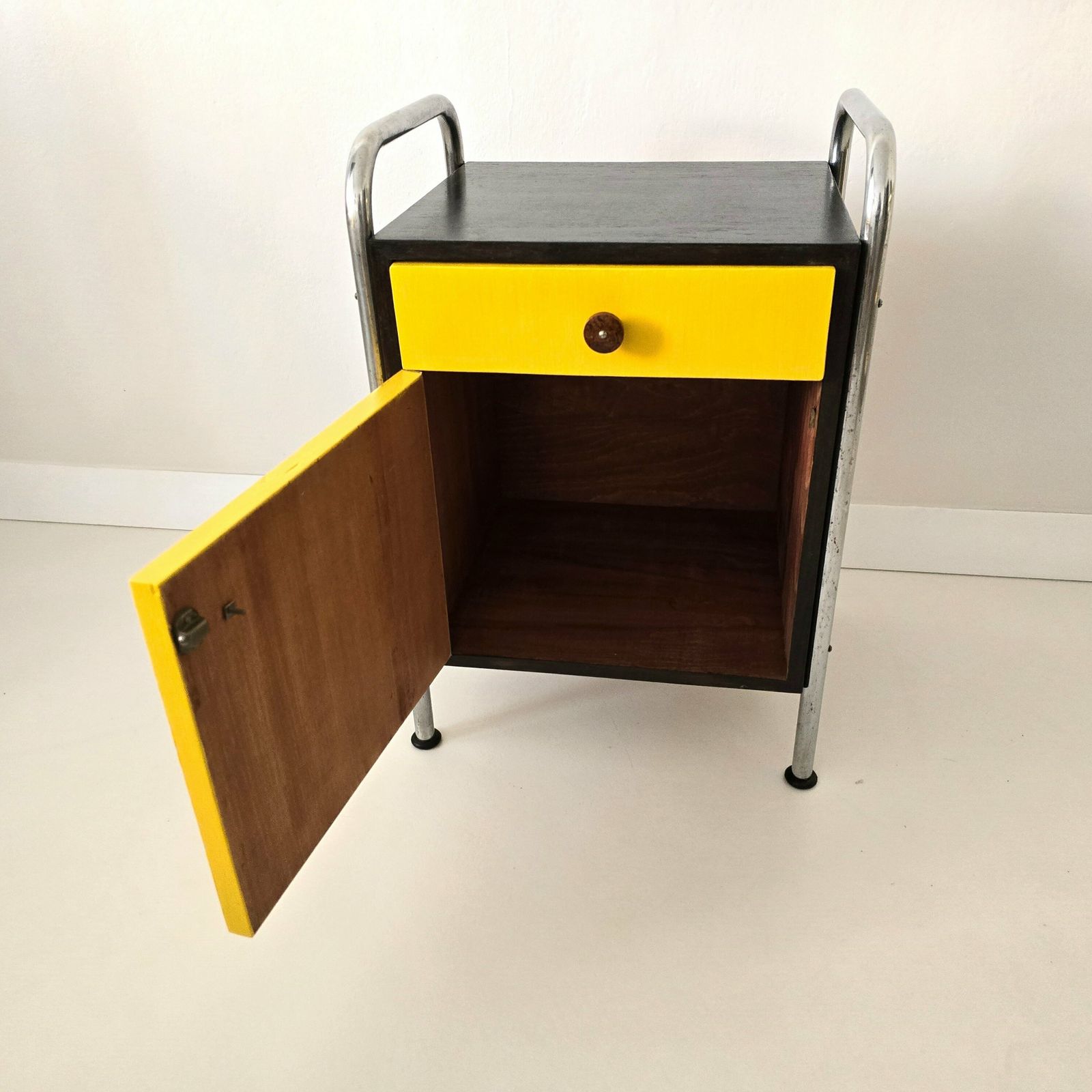 Vintage Bauhaus Night Cabinet With Black And Yellow Drawer After Renovation photo vinterior