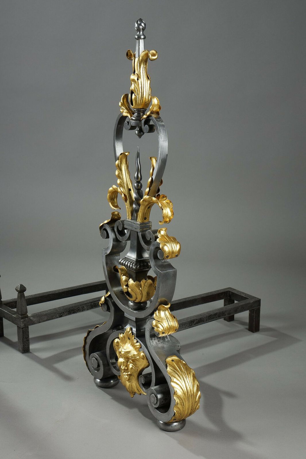 4040.0 Pair Of Wrought Iron Landiers With Foliage, Mask And Scroll Decoration photo