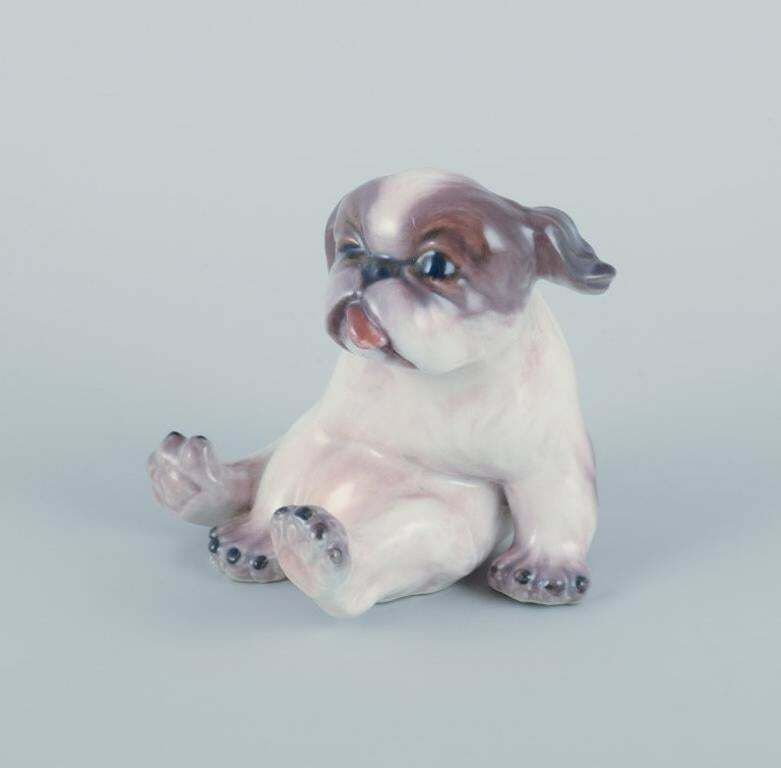 Dahl Jensen, Porcelain Figurine Of A Pekingese Puppy. photo for sale