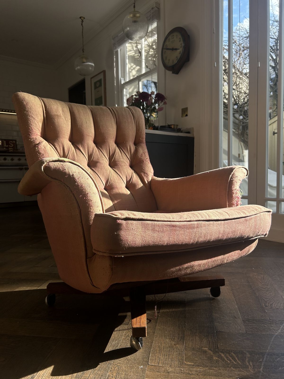 Swivel Wing Chair With A Textured Fabric In Burnt Amber Colour