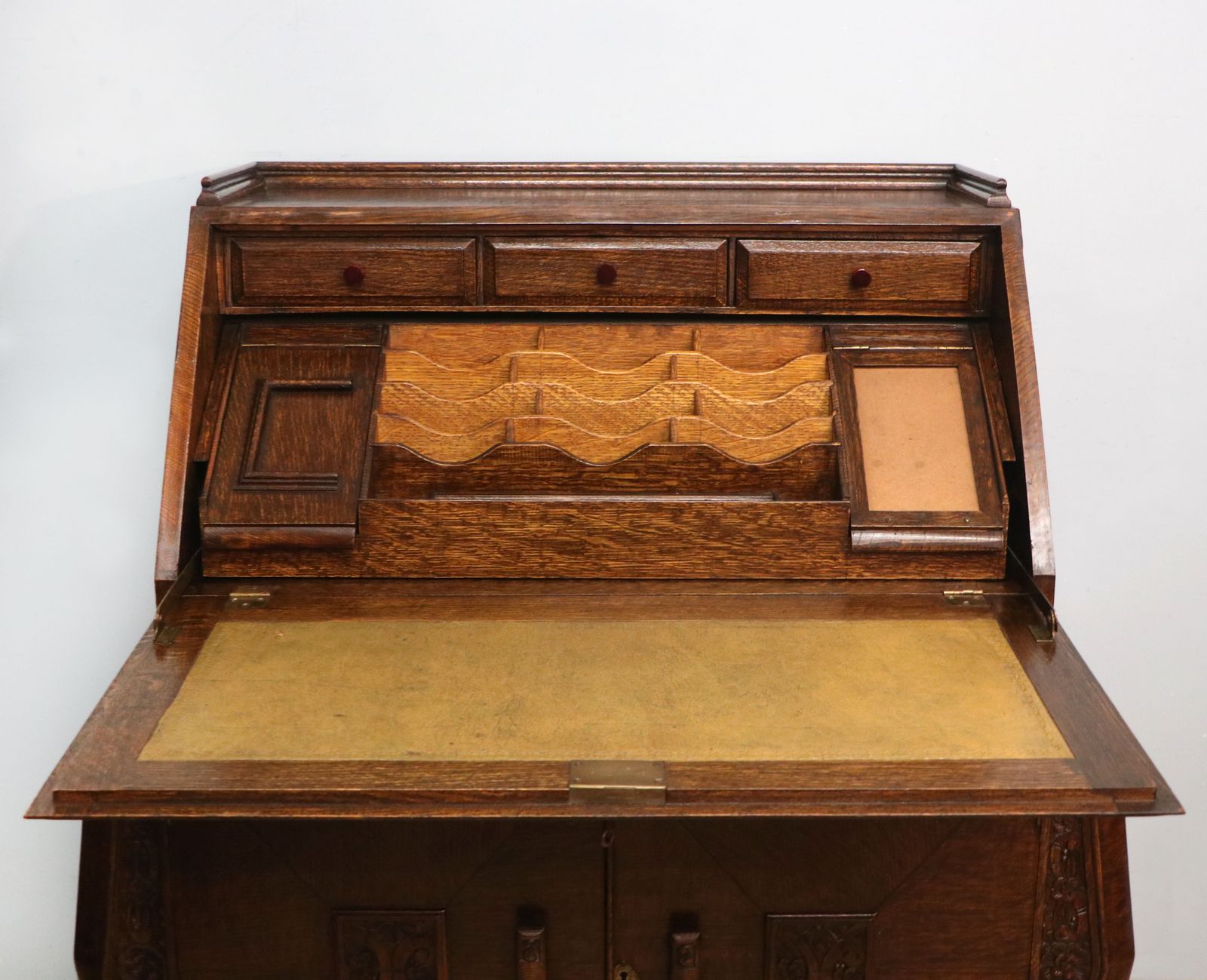 photo buy A Most Unusually Configured Oak Veneered Bureau.