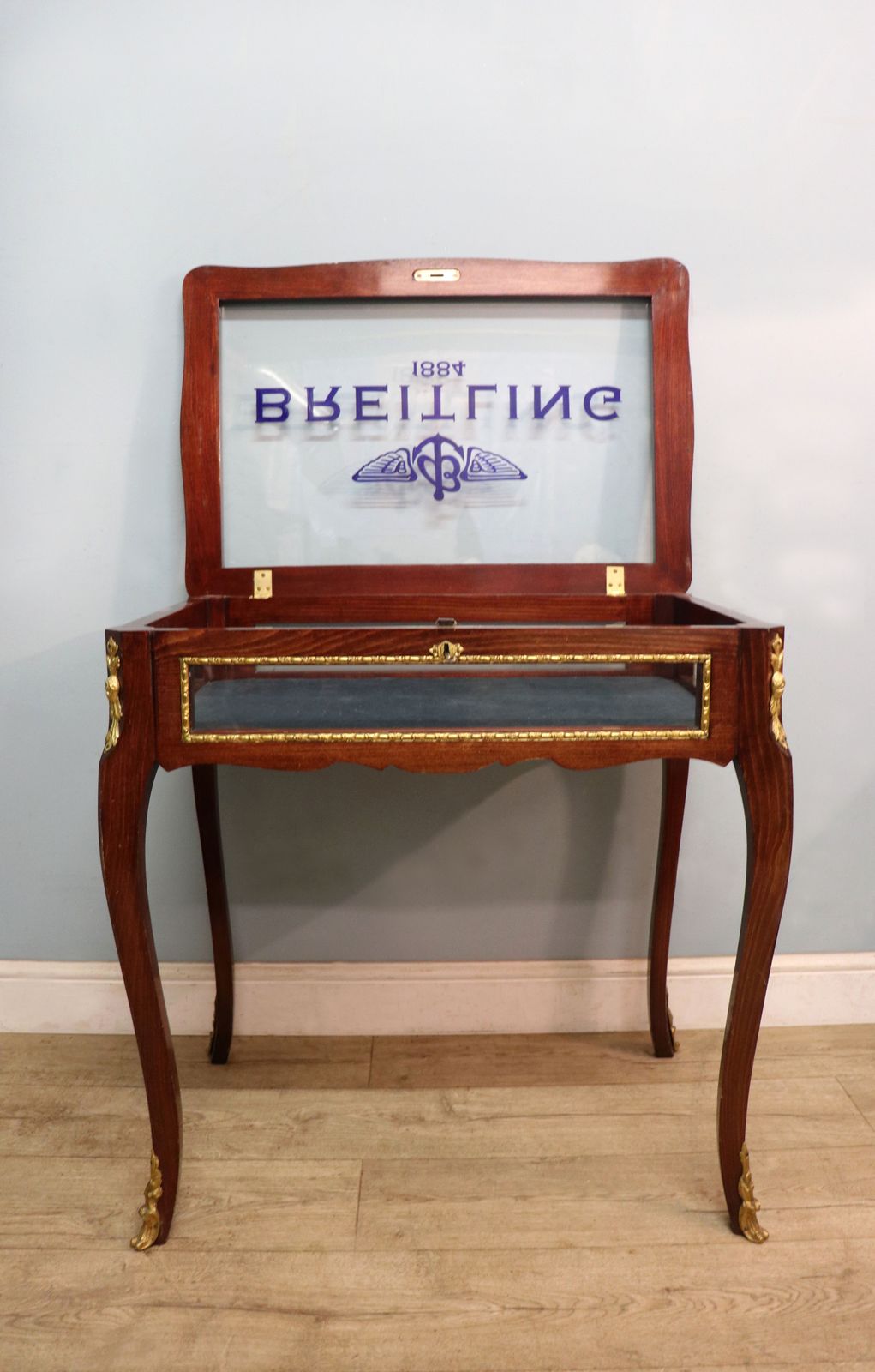 695.0 A Lovely 20th Century French Hardwood Bijouterie Display Table Later Sign Written For Breitling Watches. photo