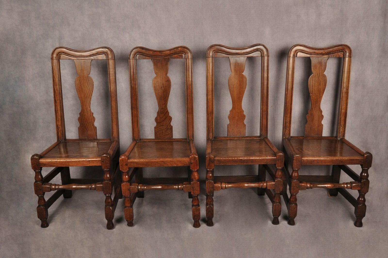 A Set Of Four Queen Anne Oak & Elm Chairs