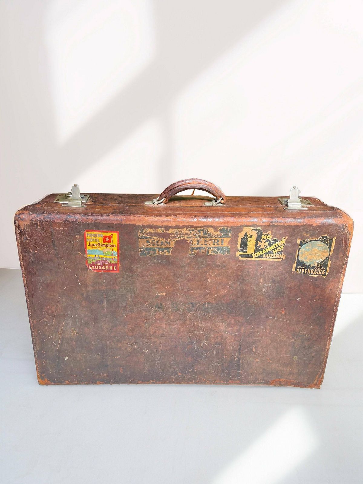 Vintage/Antique Large Heavy Tan Leather Suitcase Stamped Army And Navy London With Stickers Circa 1930