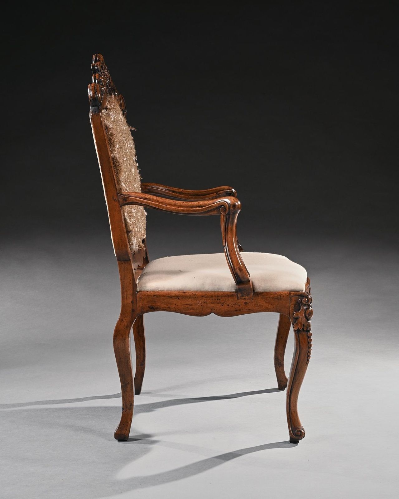 Mid 18th Century Italian Rococo Armchair In Walnut With Extravagantly Carved Head Rail photo furniture