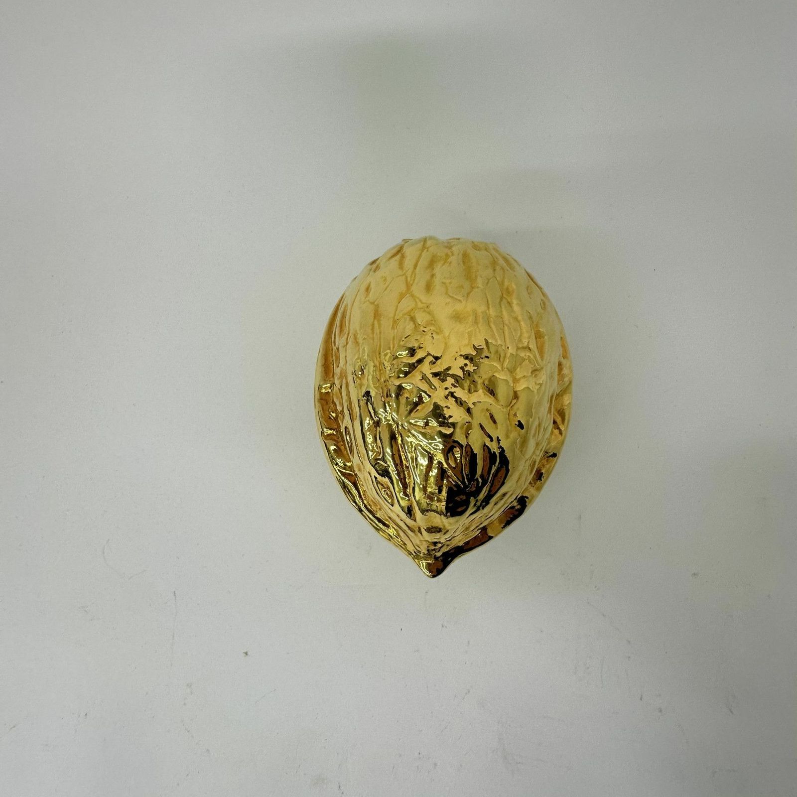 photo vintage Vintage Gold Walnut Shaped Nut Cracker , 1970’s