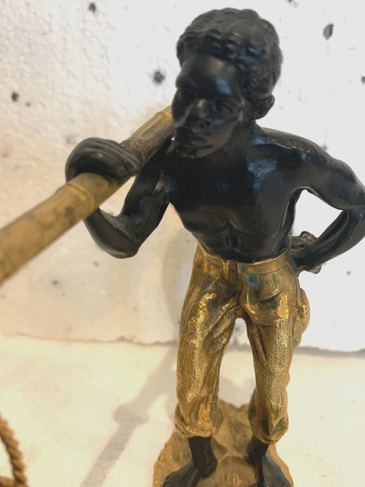 photo for sale Bronze Group With Double Patina "Man With Basket Pendulum" 20th Century
