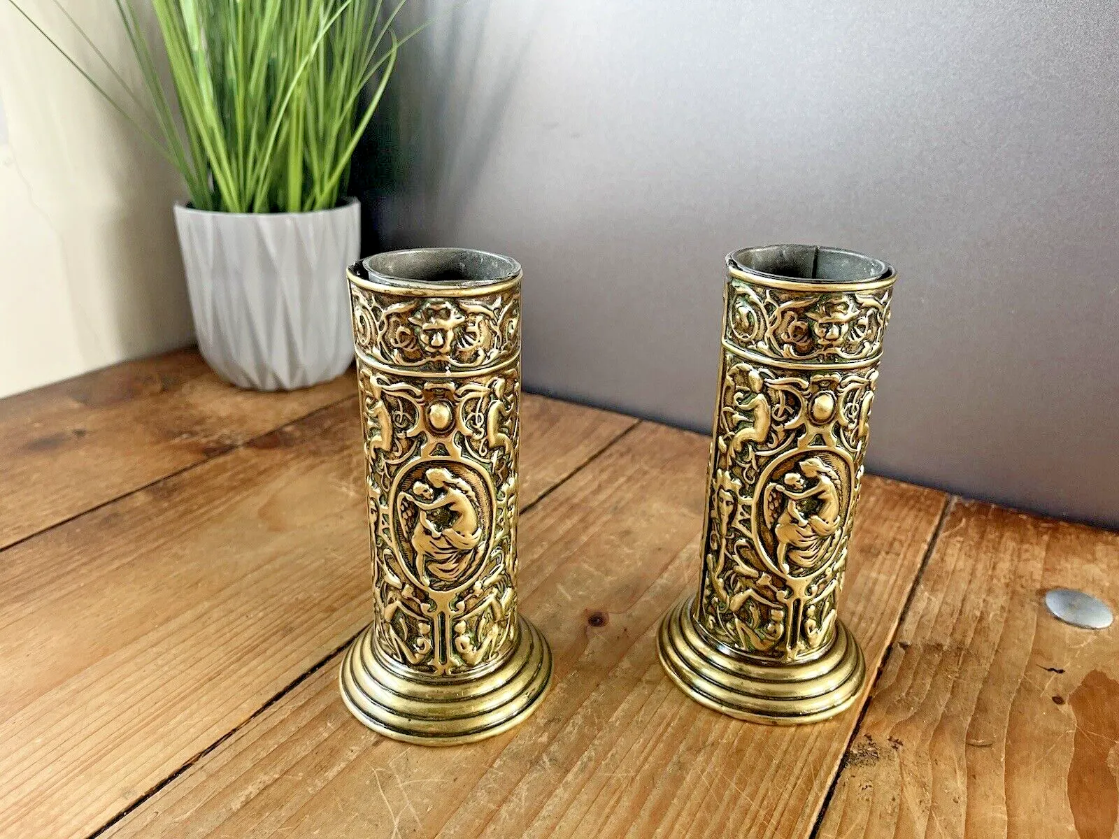 photo furniture Pair Of Antique French Art Deco Stepped Base Repousse Mantel Spill Vases Cupid