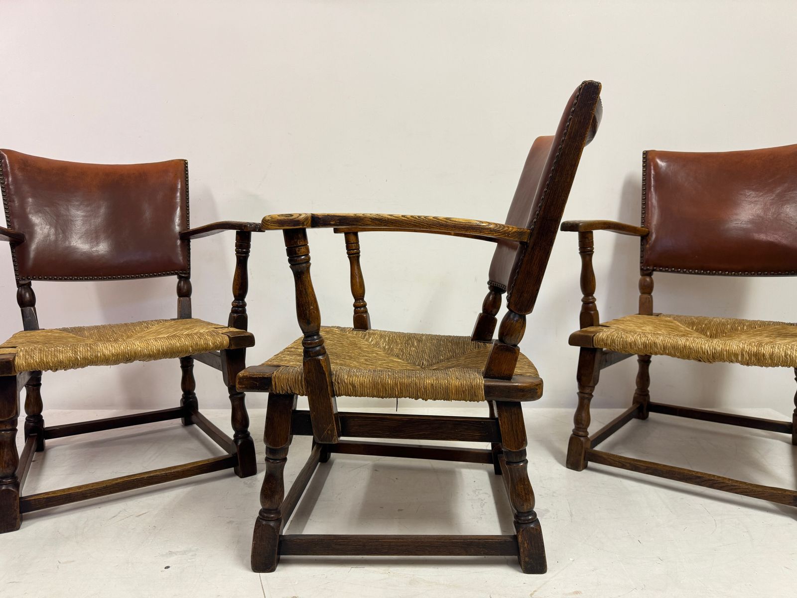 1195.0 Set Of Three Oak Armchairs With Rush And Leather Seats photo