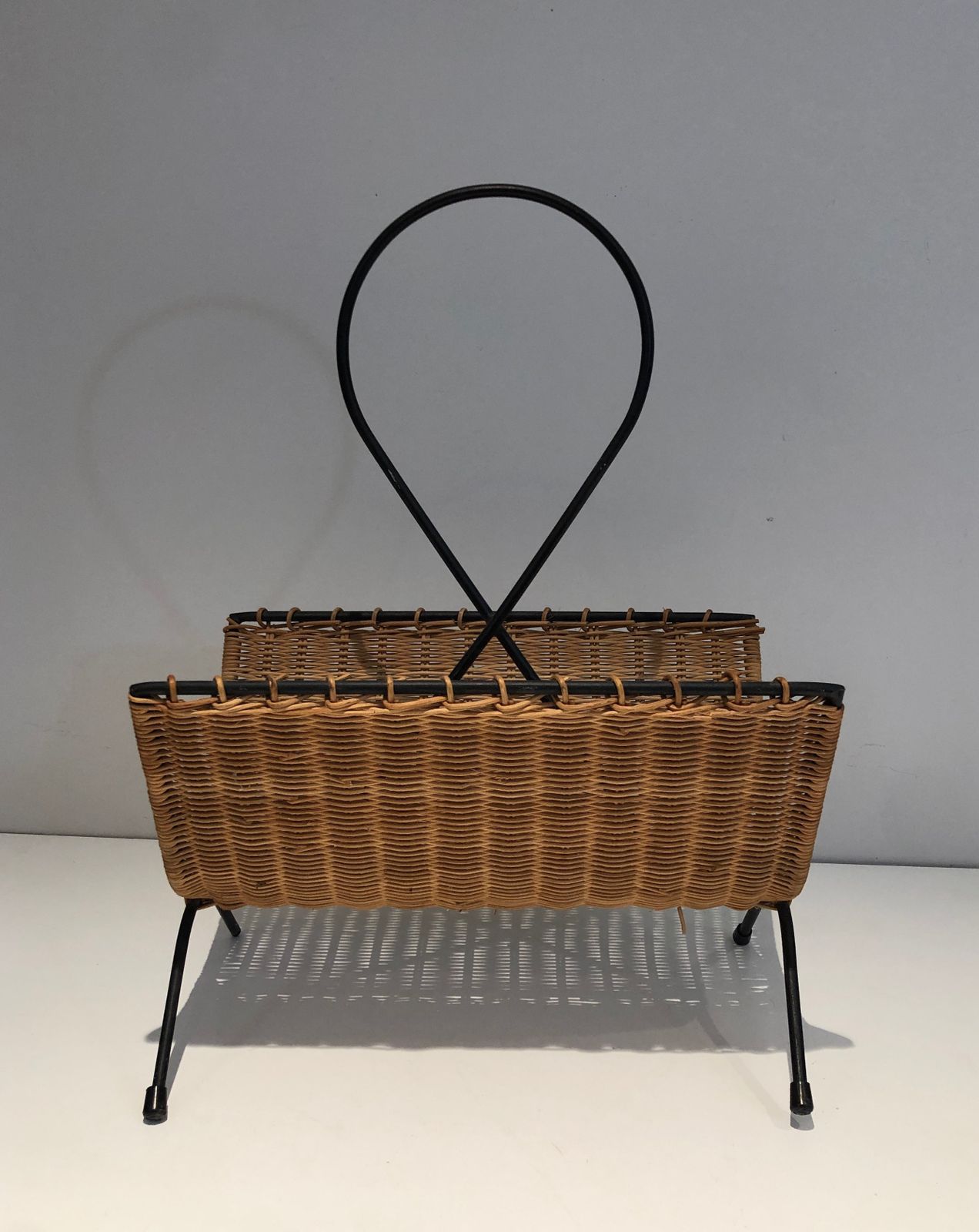 photo for sale Rattan And Black Lacquered Metal Magazine Rack