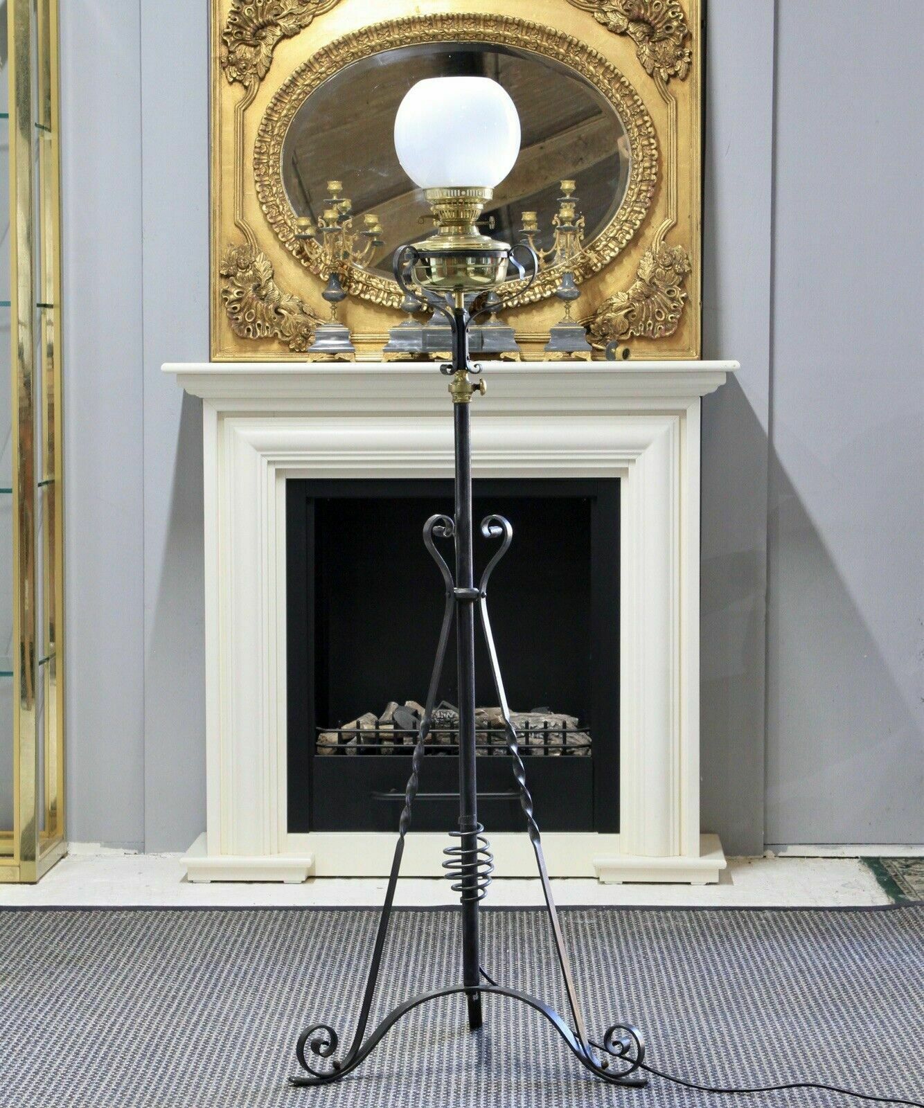 An Arts & Crafts Style Wrought Iron Brass Rise And Fall Standard Lamp photo furniture
