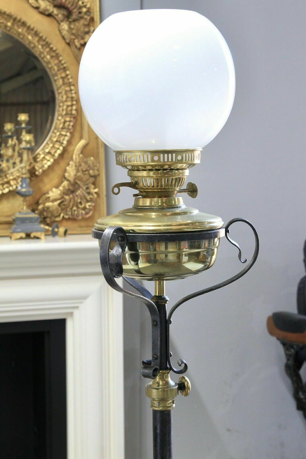 An Arts & Crafts Style Wrought Iron Brass Rise And Fall Standard Lamp photo for sale