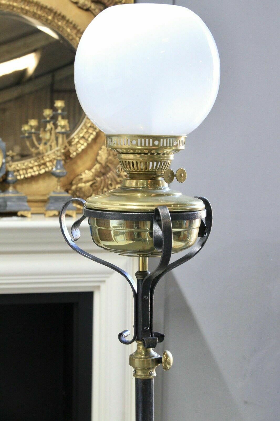 An Arts & Crafts Style Wrought Iron Brass Rise And Fall Standard Lamp photo buy