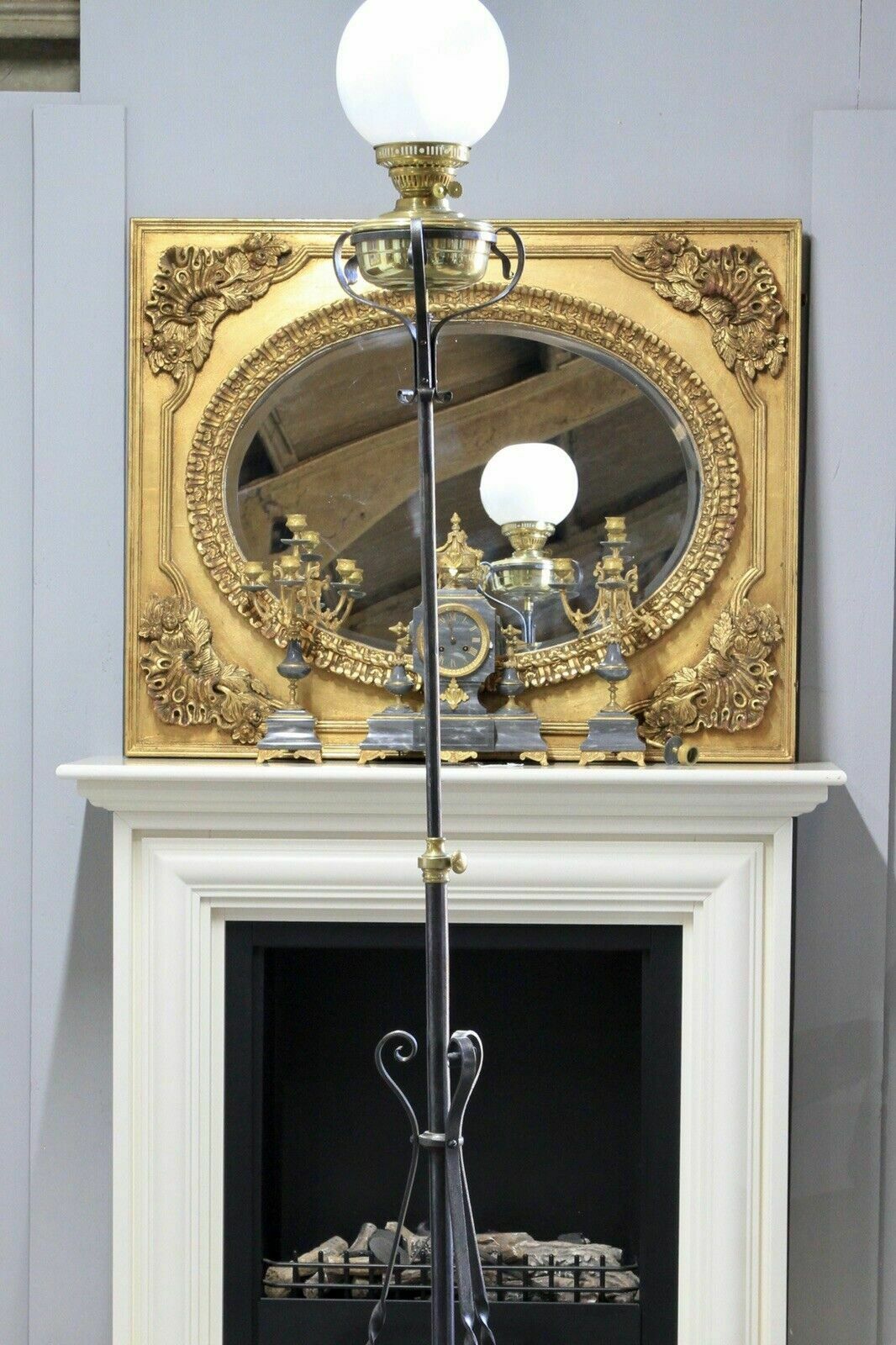 photo furniture An Arts & Crafts Style Wrought Iron Brass Rise And Fall Standard Lamp