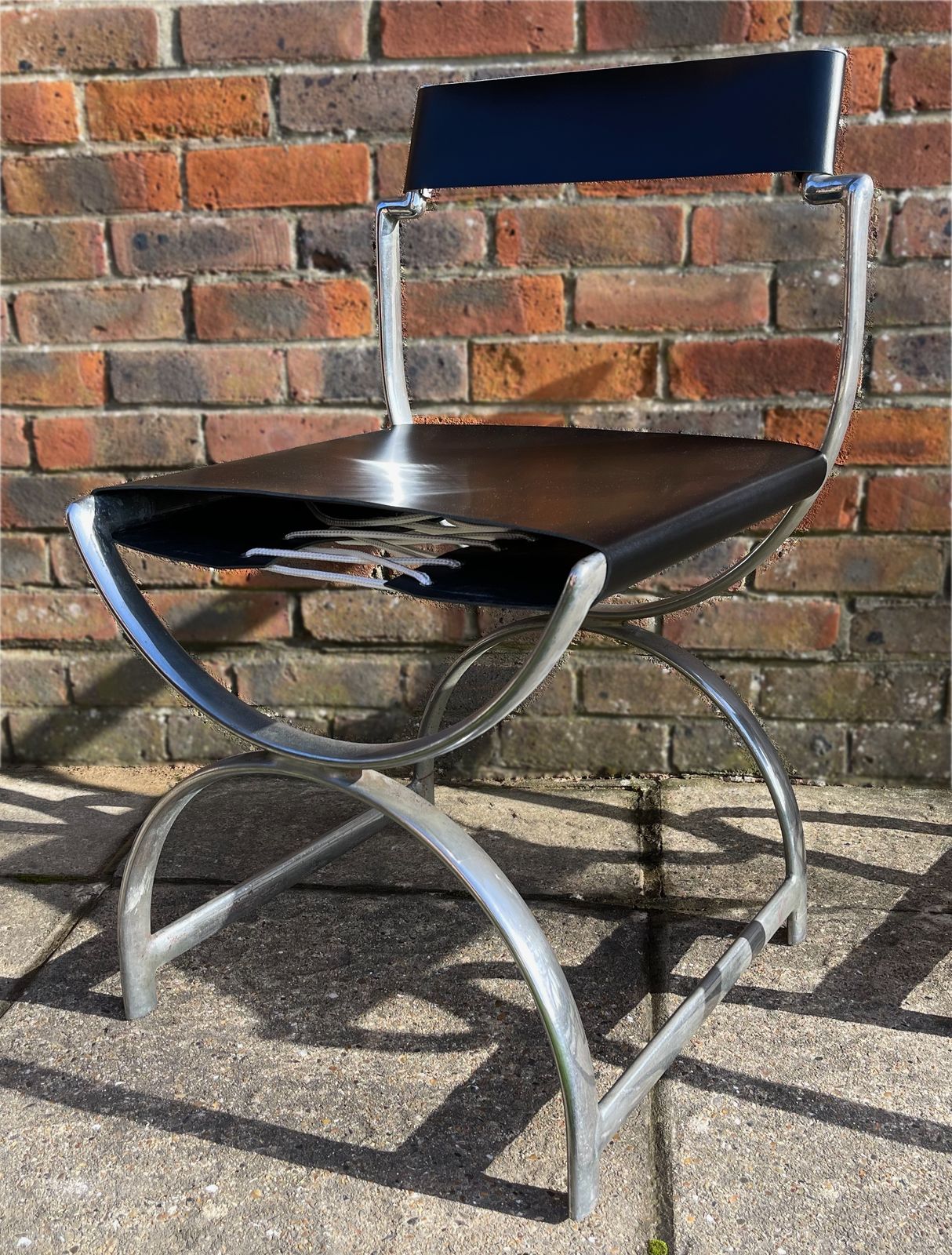 photo furniture Ambrose Heal, A Rare Pair Of Original Heal's 1930s Chromium Plated Tubular Steel And Leather Roman Curule Side Chairs