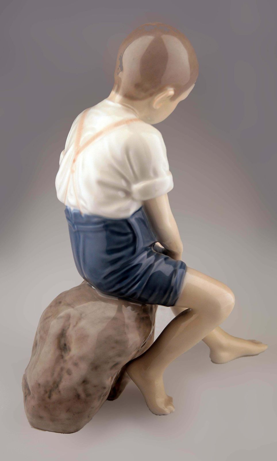 Mid 20th Century Scandinavian Modern Glazed Porcelain Sculpture Of A Boy Sitting On A Rock By Danish Company Bing & Grøndahl photo Home Decor