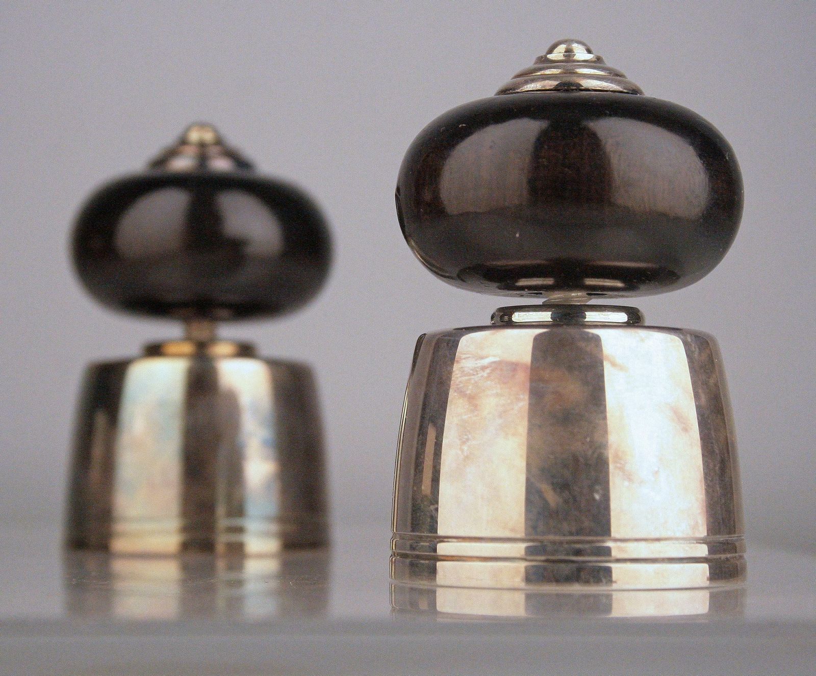 photo furniture Pair Of French Black Lacquer And Silver Champagne Corks/Bottle Stoppers By Christofle