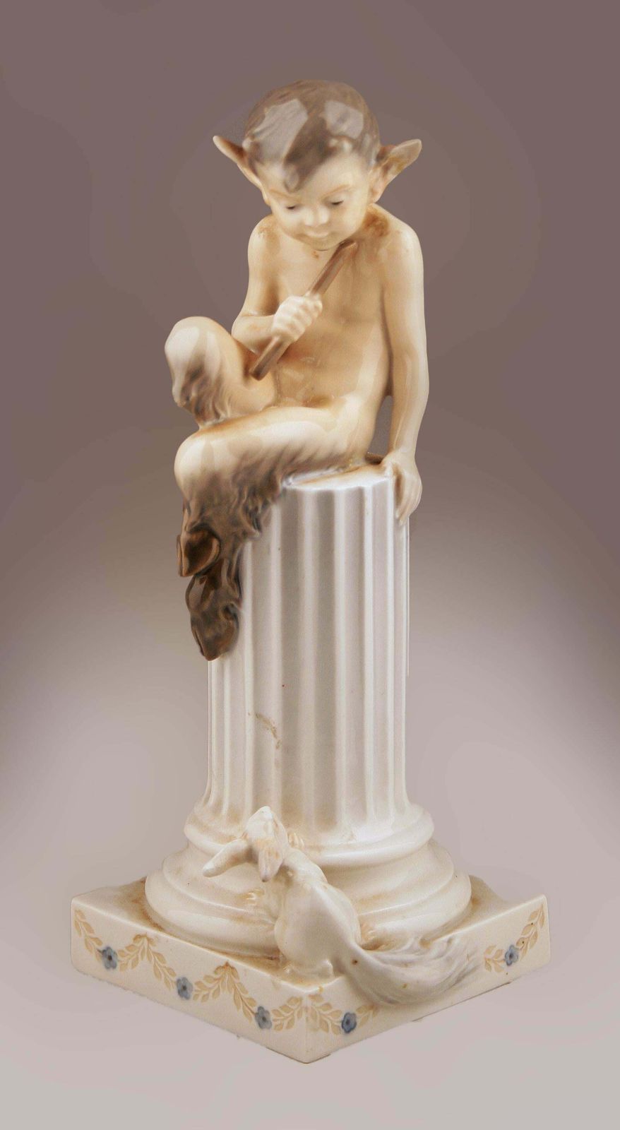 Mid 20th Century Danish Glazed Porcelain Sculpture Of Faun (Satyr) Sitting Over A Column And A Rabbit By Danish Firm Royal Copenhagen photo furniture