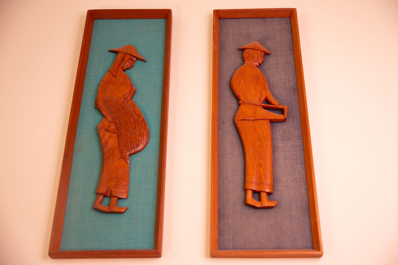 photo furniture Pair Of Mid Century South East Asian Hardwood Wall Sculptures On Blue Canvas In Teak Frames