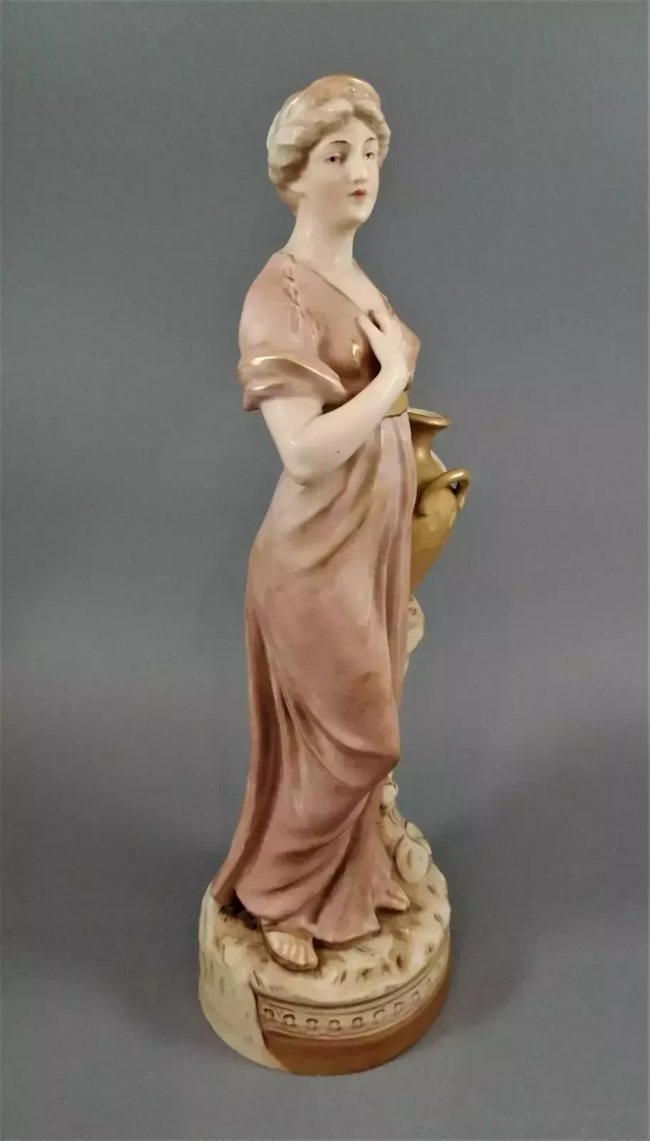Beautiful Antique Royal Dux Porcelain Figurine Depicting A Lady Holding A Jug. photo buy