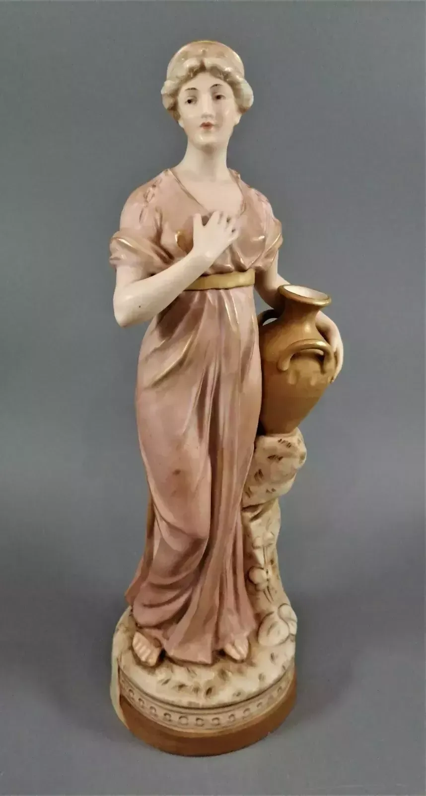 Beautiful Antique Royal Dux Porcelain Figurine Depicting A Lady Holding A Jug. photo vintage