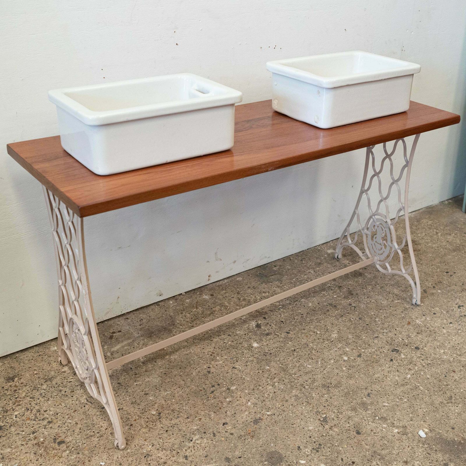 Twin Countertop Butler Sinks On Reclaimed Cast Iron And Teak Unit photo vinterior