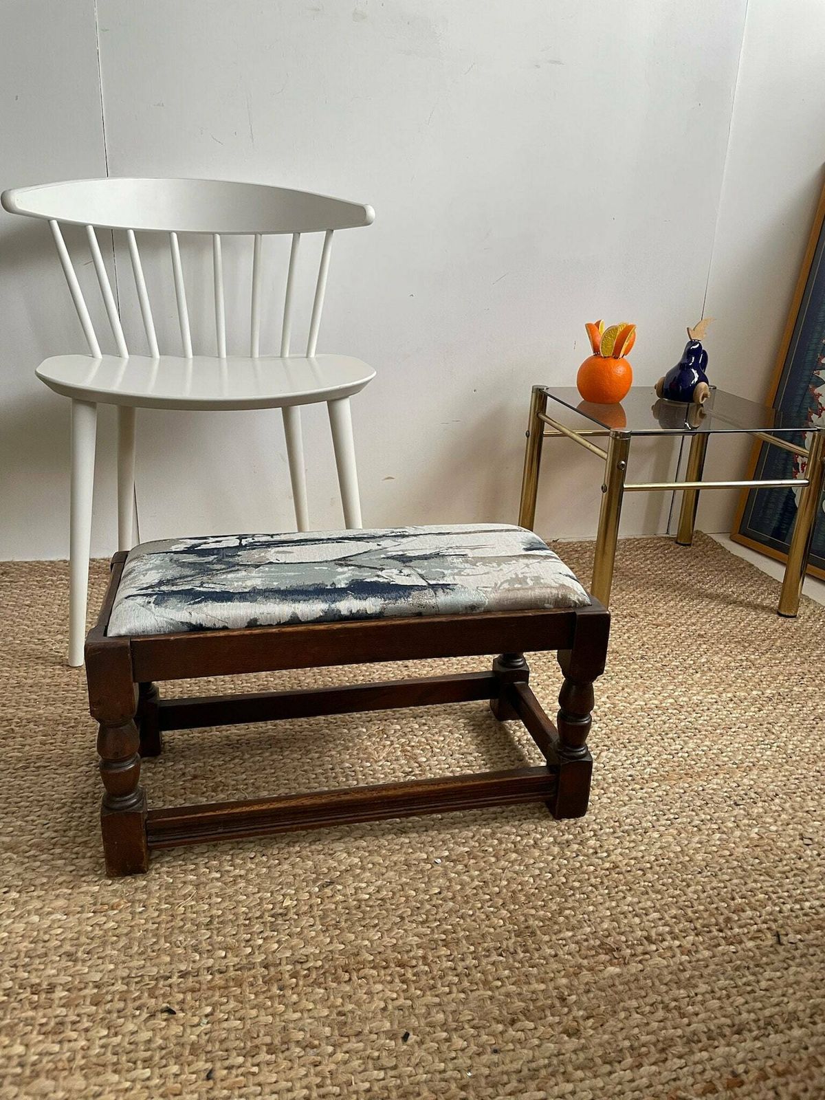 photo furniture Chunky Dark Wooden Footstool With Andrew Martin Ink Blue Fabric Top
