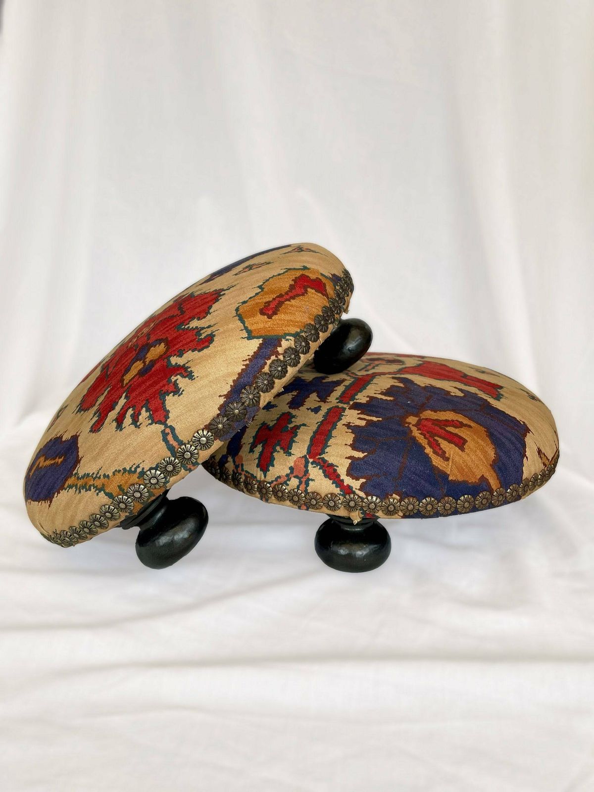 photo furniture Antique French Style Foot Stools In Original Fabric With Floral Brass Flower Stud Detailing And Three Wooden Bun Feet To Base.
