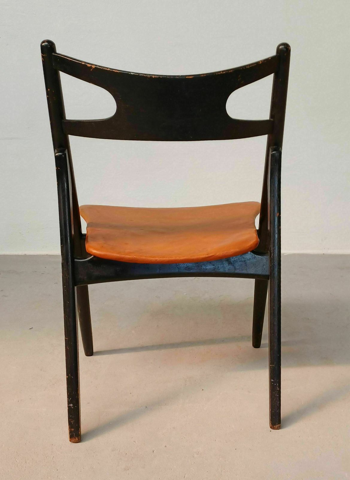 photo for sale Patinated Hans Wegner Sawbuck Chair With Original Leather 1950s