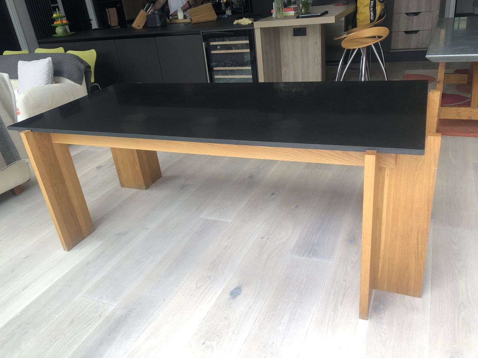 Heals Black Granite And Oak Leg Dining Table In Excellent Condition.  Smooth Black Granite Top, Four Square Oak Legs.  Easy To Transport (Although Heavy Top) As Top Lifts Off A Rectangular Oak Frame And The Four Oak Legs Are Then Removed Separately.