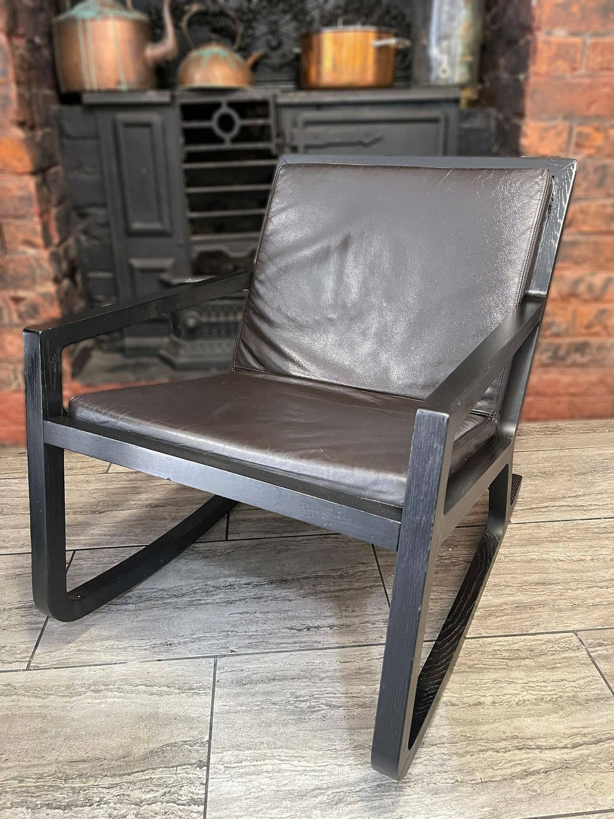 Early 2000's Modernist Black Wood Rocking Chair With Reupholstered Leather Seat And Back Rest Cushion By James Harrison
