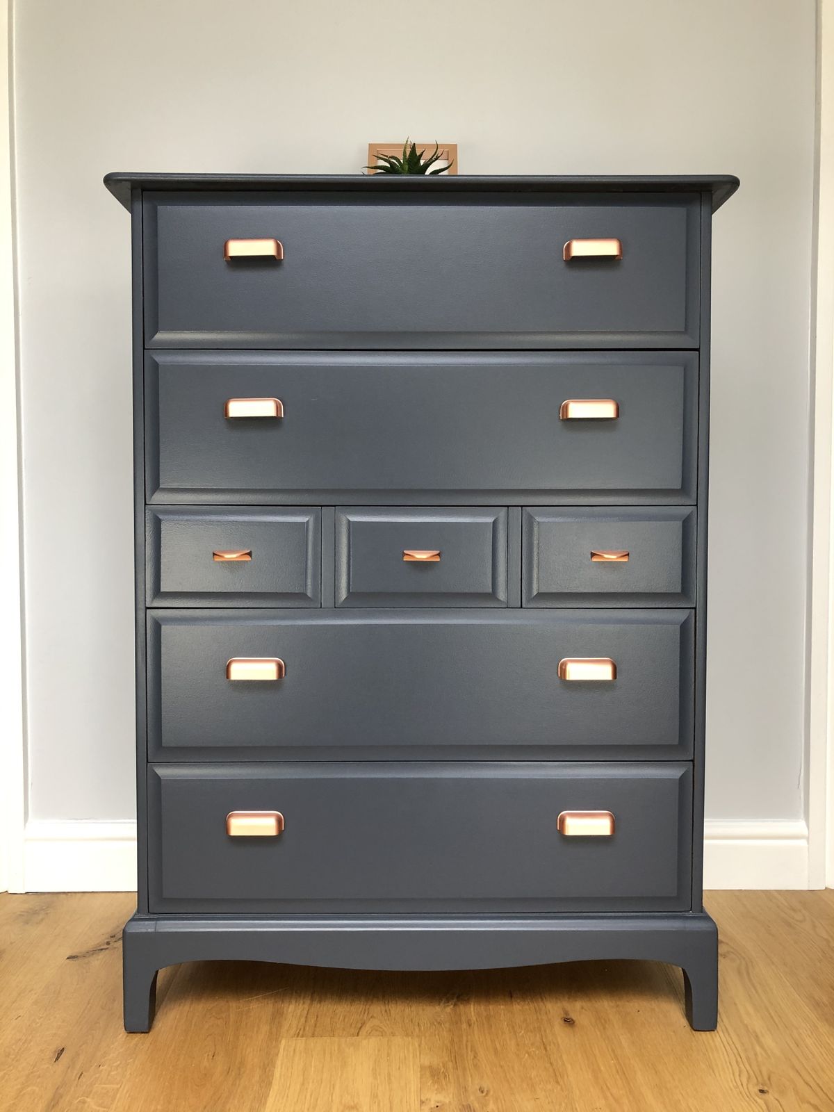 A Pair Of Stag Minstrel Tallboy Chest Of Drawers Painted Blue With Copper Handles photo vinterior