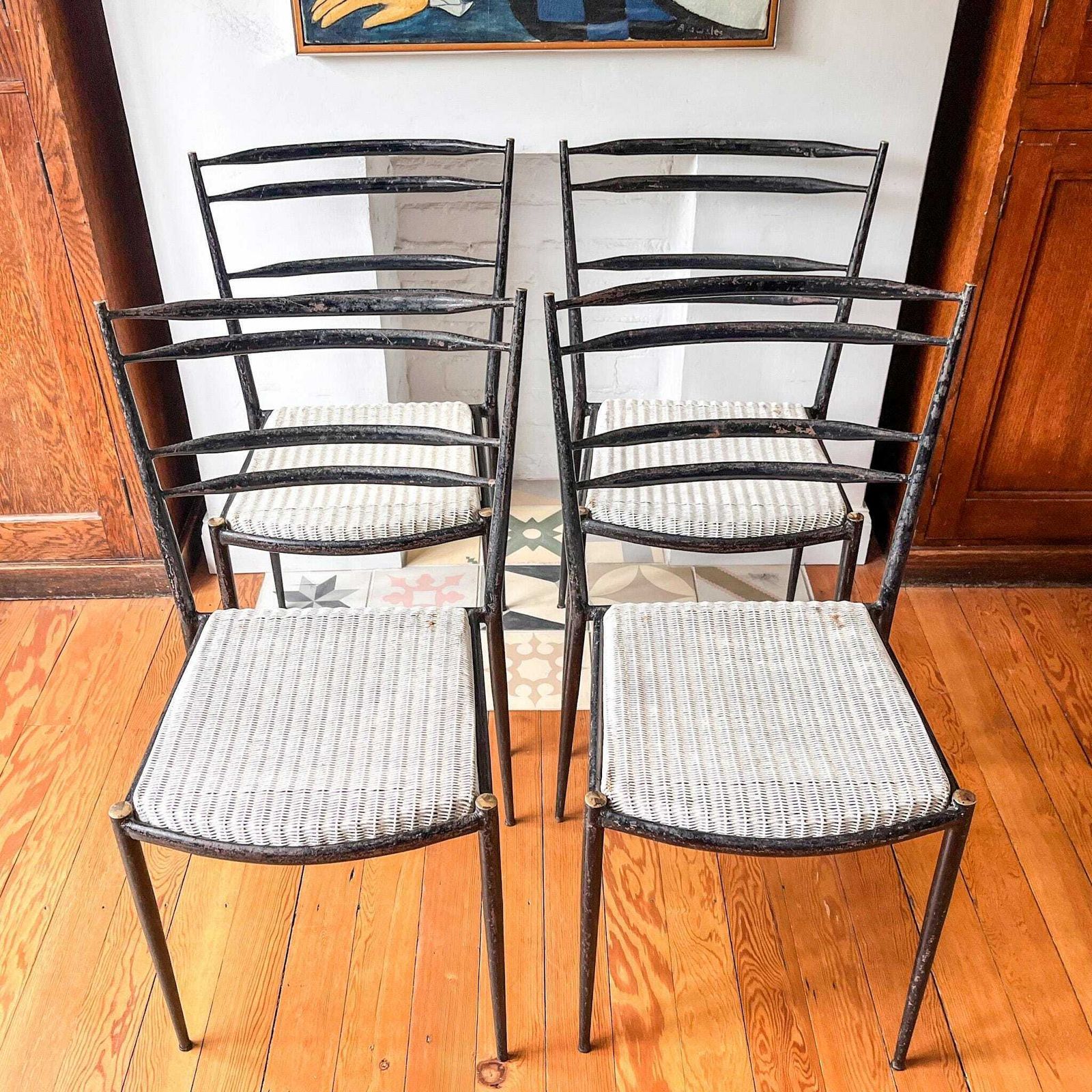A Set Of Four Mid Century Metal And Wicker Dining Chairs By Lloyd Loom photo furniture