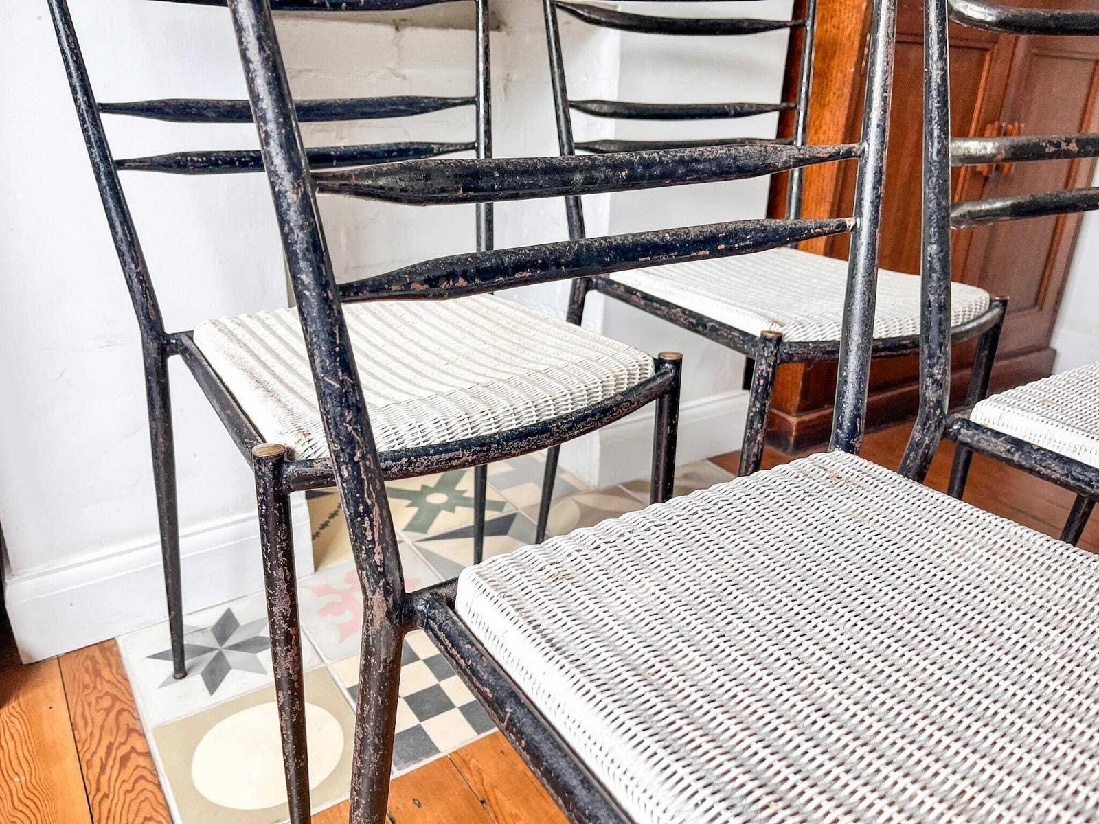 A Set Of Four Mid Century Metal And Wicker Dining Chairs By Lloyd Loom photo buy