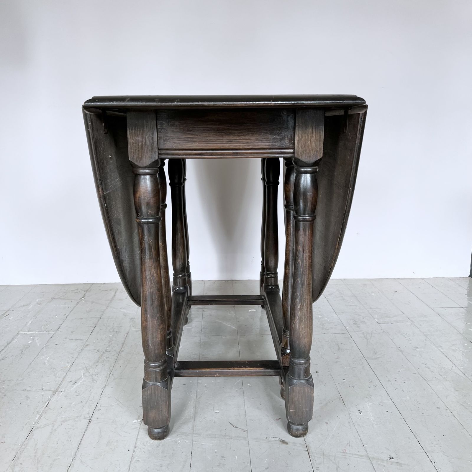 Dark Stained Solid Wood Oval Drop Leaf Table photo 395.0