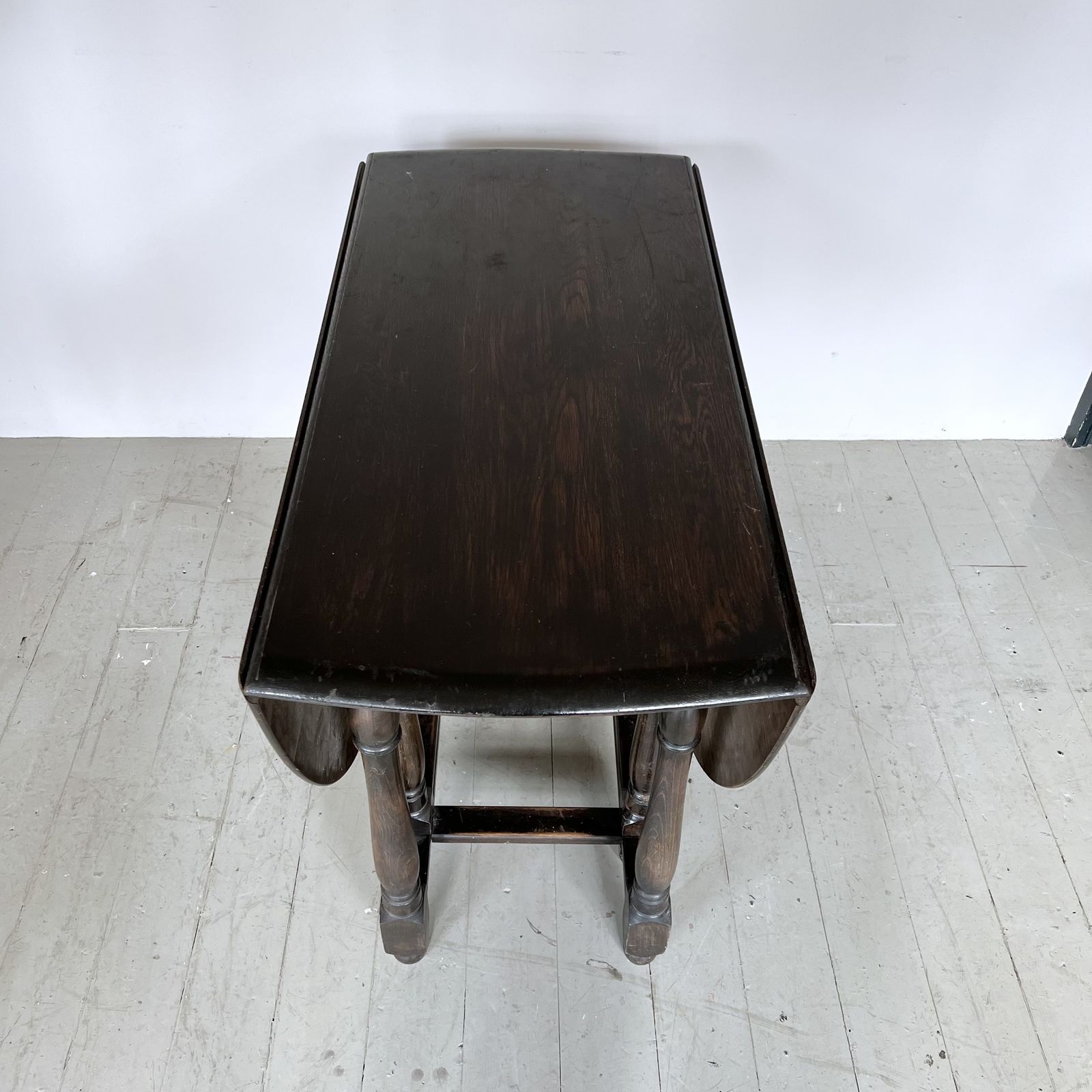 Dark Stained Solid Wood Oval Drop Leaf Table photo vinterior