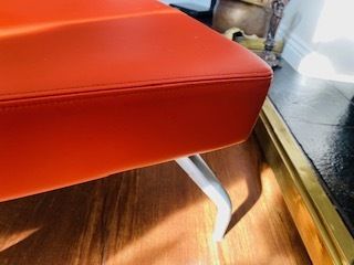 Mid Century Danish Style Long Bench. Orange Vinyl Upholstery And Stainless Steel Legs. Orangebox. photo Furniture