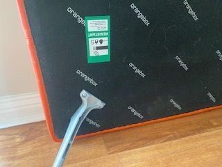 Mid Century Danish Style Long Bench. Orange Vinyl Upholstery And Stainless Steel Legs. Orangebox. photo vinterior