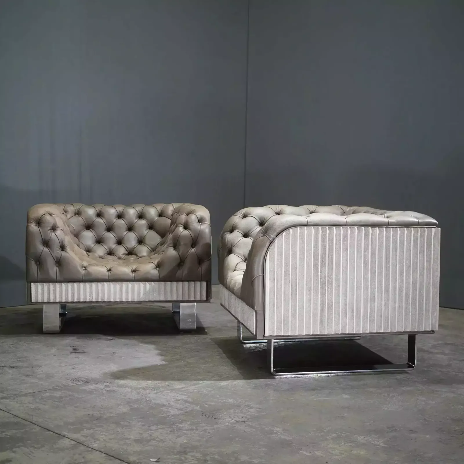 photo furniture Bespoke Concrete Armchair In Pewter Grey Napa Leather With Soft Chesterfield Detailing