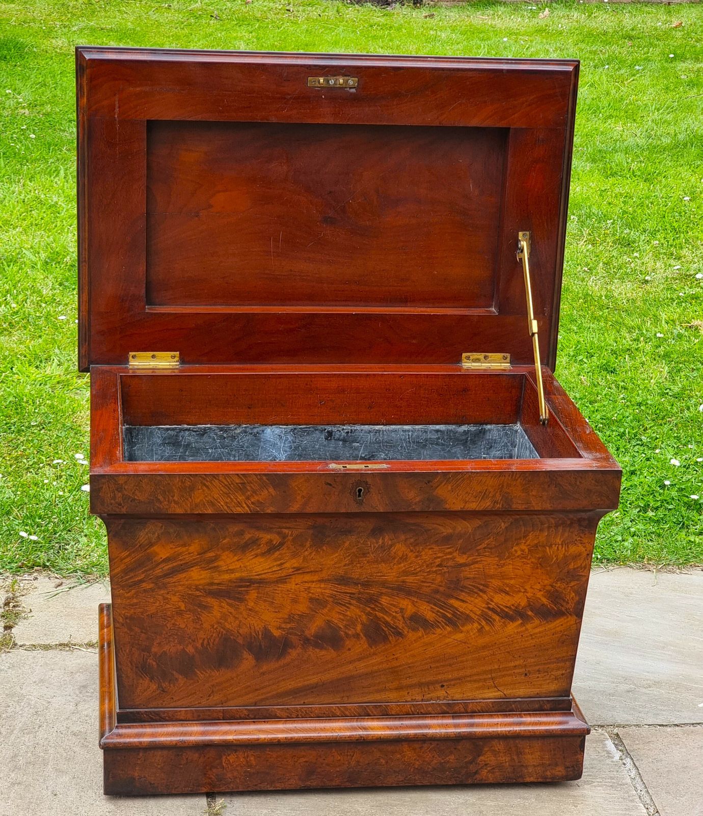 photo vinterior An English Regency Wine Cooler Sarcophagus Shaped And Superbly Veneered In Flame Mahogany, Circa 1820