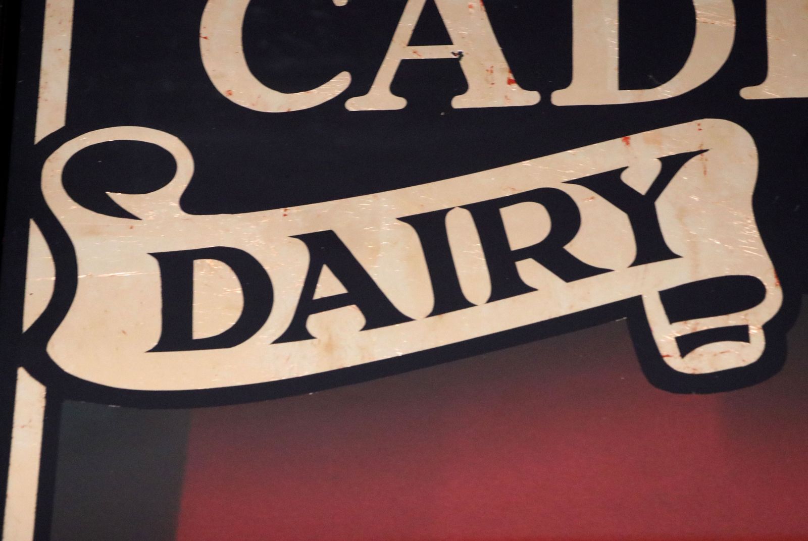 A Superb Wedge Shaped Countertop Display Cabinet, Later Hand Sign Written For Cadburys Dairy Milk Chocolate. photo buy