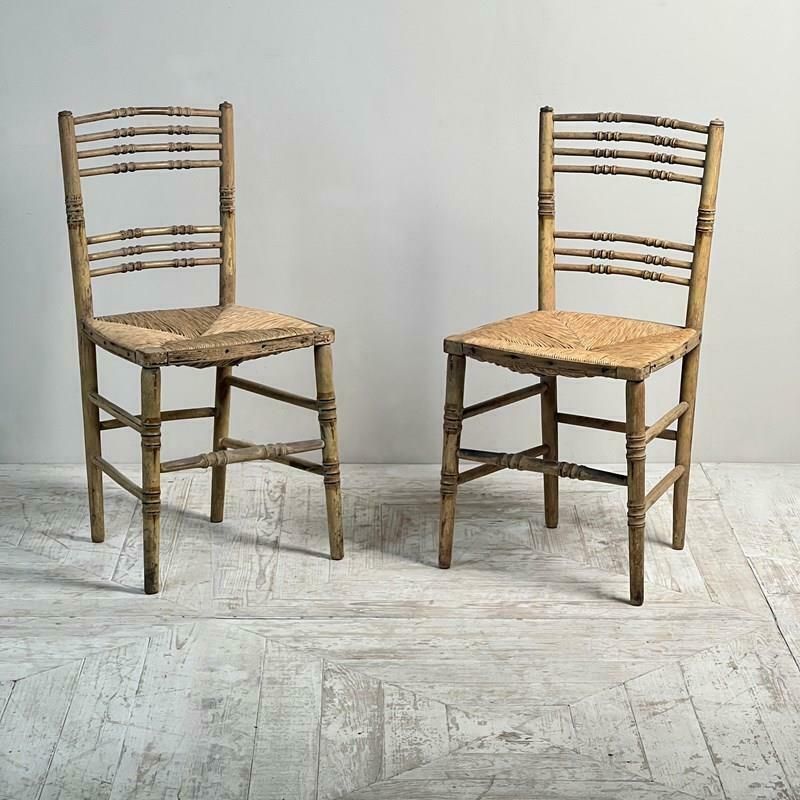 A Pair Of Painted Regency Faux Bamboo And Rush Seat Chairs photo for sale