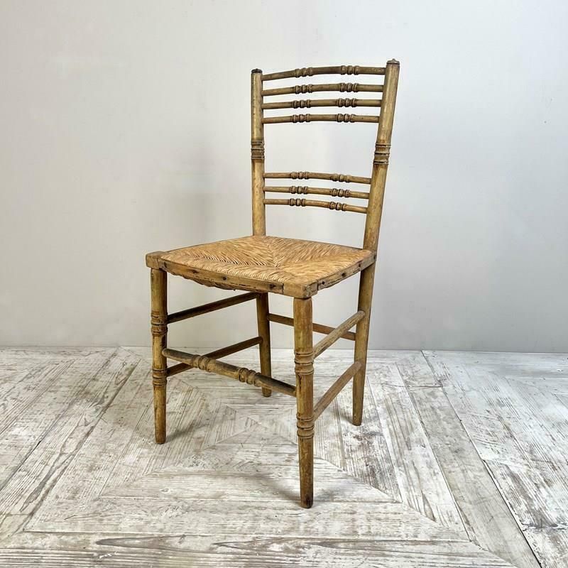 A Pair Of Painted Regency Faux Bamboo And Rush Seat Chairs photo vinterior