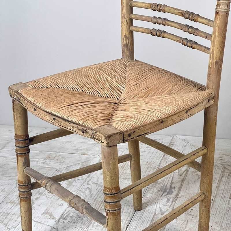 A Pair Of Painted Regency Faux Bamboo And Rush Seat Chairs photo buy