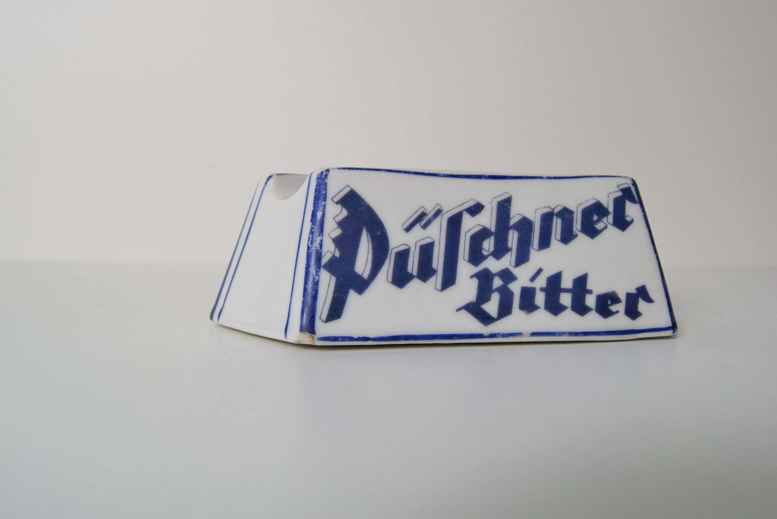 photo furniture Art Deco Porcelain Advertising Ashtray Püschner Bitter, 1920's.